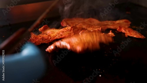 Chicken Tikka closeup cooked on hot plate grill
