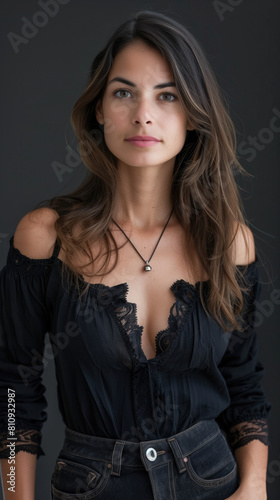 beautiful brasilian woman wearing black, studio background