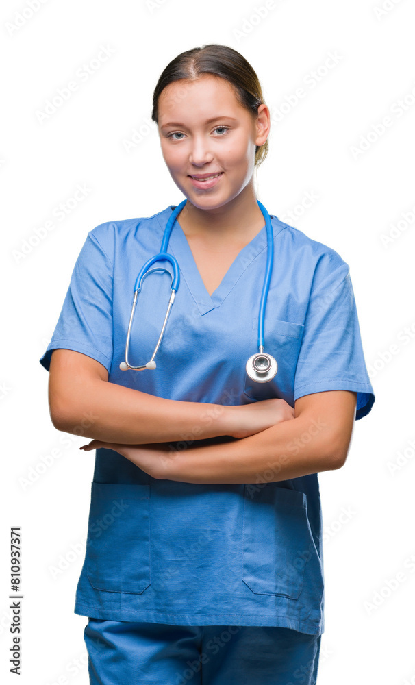 Young caucasian doctor woman wearing medical uniform over isolated background happy face smiling with crossed arms looking at the camera. Positive person. Young caucasian doctor woman wearing medical uniform over isolated background happy face smiling with crossed arms looking at the camera. Positive person.