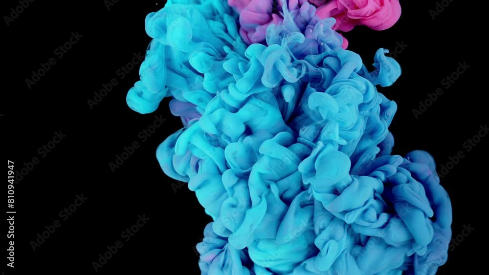 Cloud ink in water isolated on black background. blue, pink