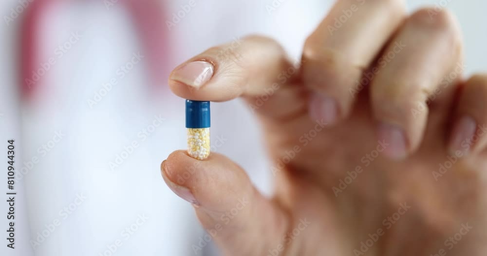 Doctor holding medical drug capsule closeup 4k movie slow motion. Modern possibilities of drug therapy concept Doctor holding medical drug capsule closeup 4k movie slow motion. Modern possibilities of drug therapy concept