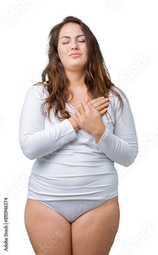 Beautiful plus size young overwight woman wearing white underwear over isolated background smiling with hands on chest with closed eyes and grateful gesture on face. Health concept.