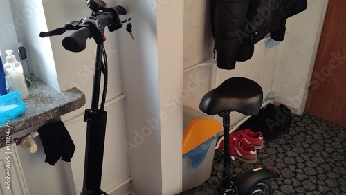 Electric scooter is charging in an apartment or in a student dorm room