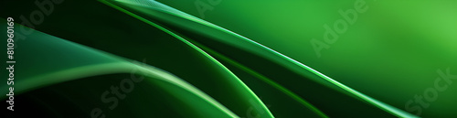 A green abstract background with smooth lines and gradients, creating an elegant and contemporary look for design projects.