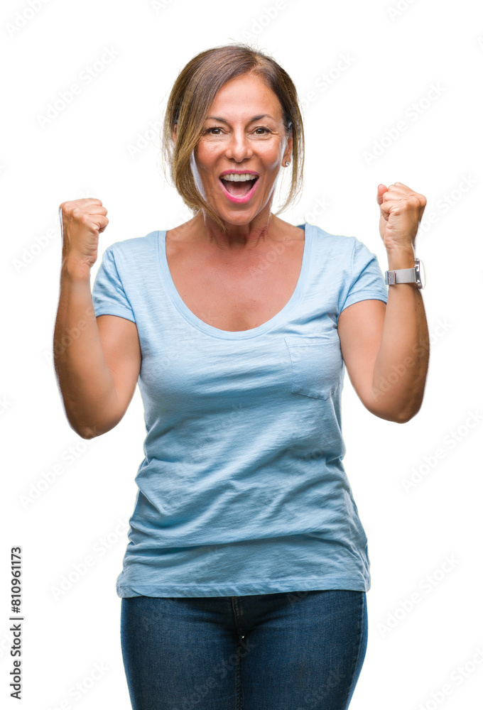 Middle age senior hispanic woman over isolated background celebrating surprised and amazed for success with arms raised and open eyes. Winner concept. Middle age senior hispanic woman over isolated background celebrating surprised and amazed for success with arms raised and open eyes. Winner concept.