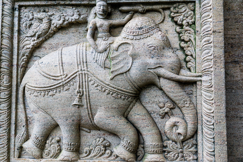 Sri-Lanka rock art of bas relief sculptures of God, Animals carved in the monolithic rock Sri-Lanka rock art of bas relief sculptures of God, Animals carved in the monolithic rock