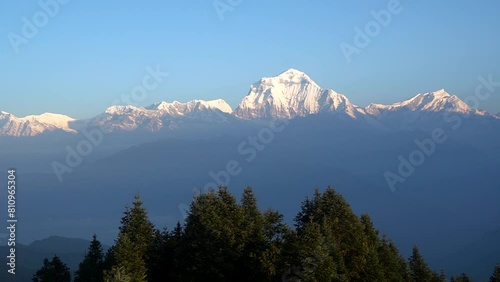 Handheld footage,Landscape nature Mt. Dhaulagiri massif snow mountain with sunrise on himalaya rang mountain in the morning seen from Poon Hill, Nepal -Blue Nature travel and trekking park and outdoor photo