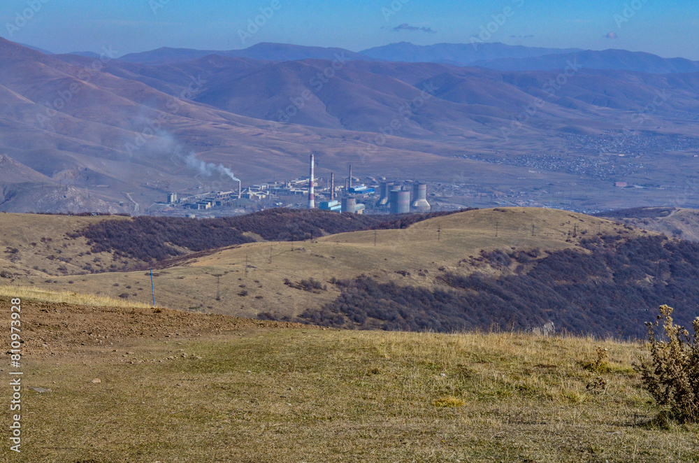 Obraz premium Hrazdan Thermal Power Plant scenic view from Tsaghkadzor Ski Resort on Mount Teghenis (Kotayk province, Armenia)