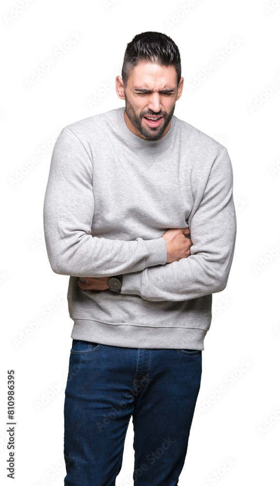 Young handsome man wearing sweatshirt over isolated background with hand on stomach because nausea, painful disease feeling unwell. Ache concept.