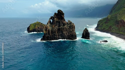 Cinematic footage of huge rock formation Ribeira da Janela in standing out of Atlantic ocean on Madeira island photo