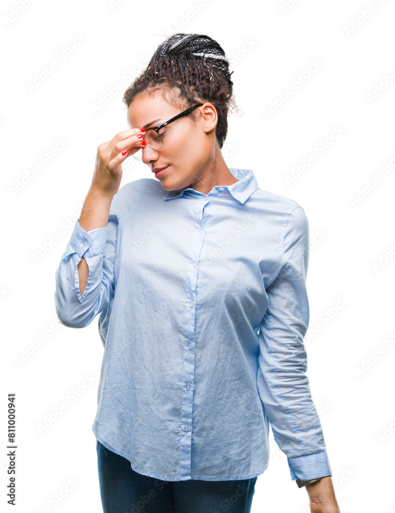 Young braided hair african american business girl wearing glasses over isolated background tired rubbing nose and eyes feeling fatigue and headache. Stress and frustration concept. Young braided hair african american business girl wearing glasses over isolated background tired rubbing nose and eyes feeling fatigue and headache. Stress and frustration concept.