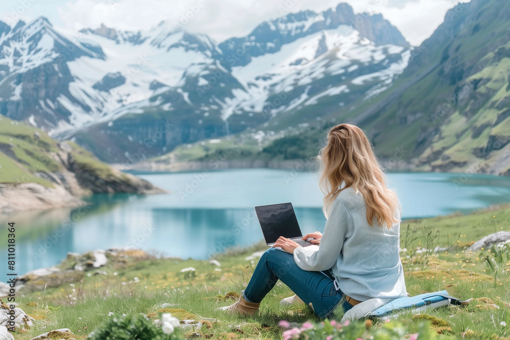 Young woman Freelancer working on laptop with beautiful nature view. Work from anywhere concept