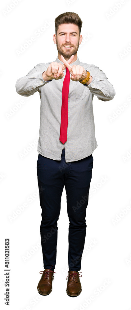 Young handsome business man Rejection expression crossing fingers doing negative sign Young handsome business man Rejection expression crossing fingers doing negative sign