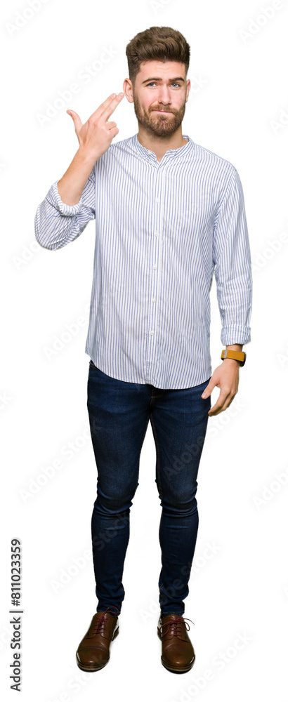 Young handsome man Shooting and killing oneself pointing hand and fingers to head, suicide gesture. Young handsome man Shooting and killing oneself pointing hand and fingers to head, suicide gesture.