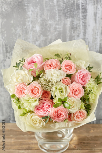 Small Beautiful bouquet of mixed flowers in vase. Floral shop concept . Beautiful fresh cut bouquet. Flowers delivery photo