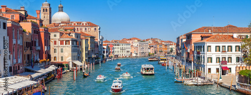 Grand canal with boat and gondola in Venice city, Italy, horizontal view. Medieval european architecture.