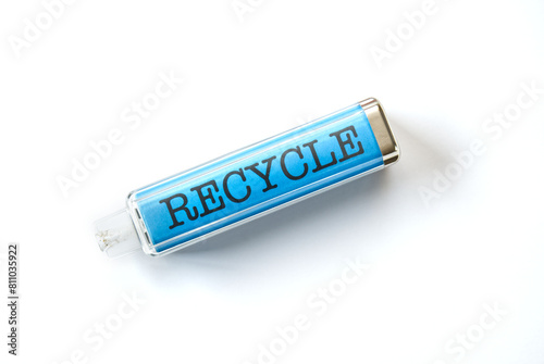 Disposable vape vibrant blue with word RECYCLE printed on the inside of the case. Isolated on a white background.
