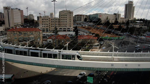 Jerusalem Chords bridge with light rail crossing, aerial view Also called Calatrava bridge, a famous unique landmark, with general view of the city.