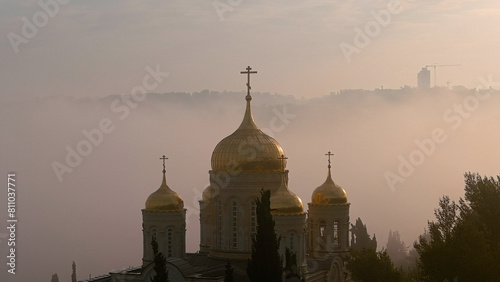 Jerusalem at sunrise  Golden Gorny Monastery  aerial  Drone shot from Jerusalem at sunset with mist clouds  may  2022 