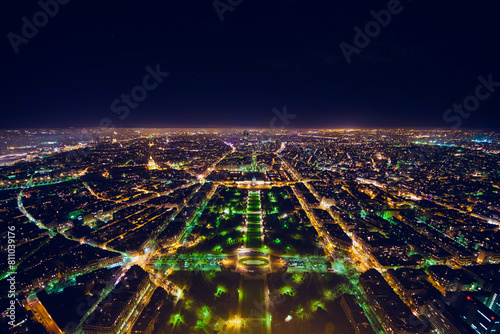 aerial view of illuminated night city panorama of Paris with street lights, drone top view from above, Champs Elysees and Elysee Palace, France photo