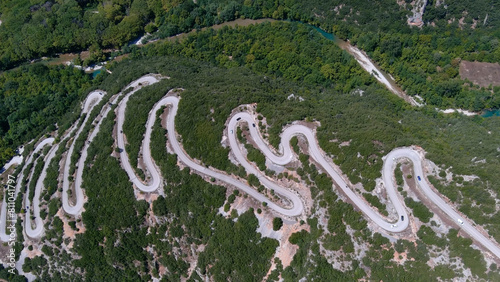Vikos Gorge road near Voidomatis River, drone,2022 Drone view of road with many zigzag in the Epirus from Greece, 2022 