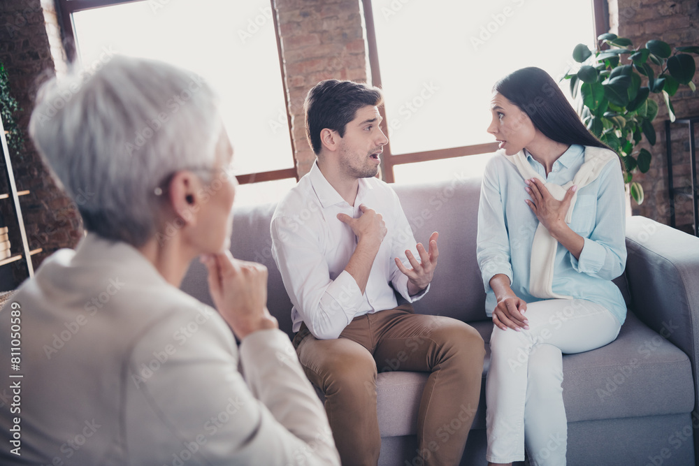 Portrait of young married couple communicate consultation visit psychotherapist lady loft interior office indoors Portrait of young married couple communicate consultation visit psychotherapist lady loft interior office indoors