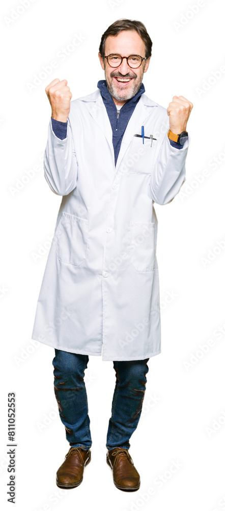Middle age therapist wearing white coat celebrating surprised and amazed for success with arms raised and open eyes. Winner concept. Middle age therapist wearing white coat celebrating surprised and amazed for success with arms raised and open eyes. Winner concept.