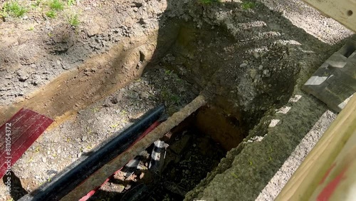 A construction site with piping visible in the ground 