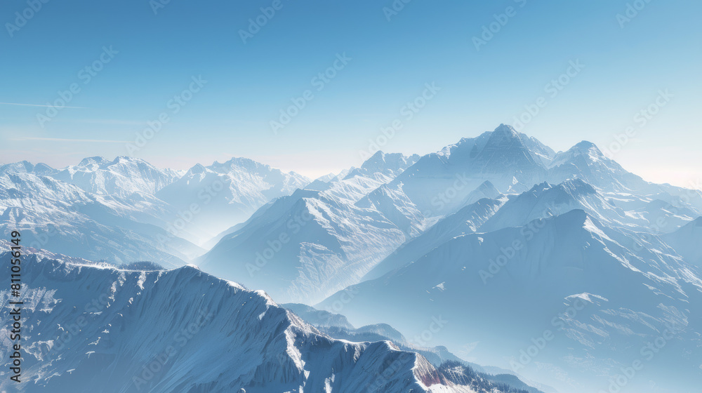 Obraz premium high-altitude drone photograph of snow-capped mountains under clear blue skies