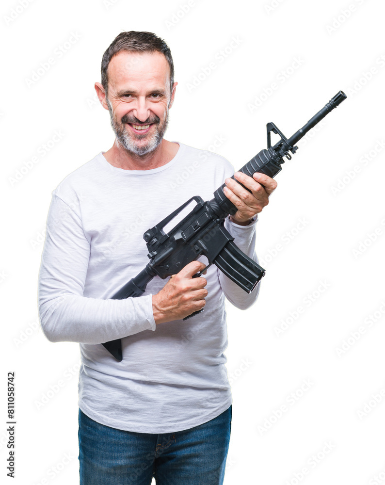 Middle age senior hoary criminal man holding gun weapon over isolated background with a happy face standing and smiling with a confident smile showing teeth Middle age senior hoary criminal man holding gun weapon over isolated background with a happy face standing and smiling with a confident smile showing teeth