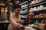 Two cheerful women engage in a friendly conversation over cosmetics products at a store counter.  African American salesperson, merchandising