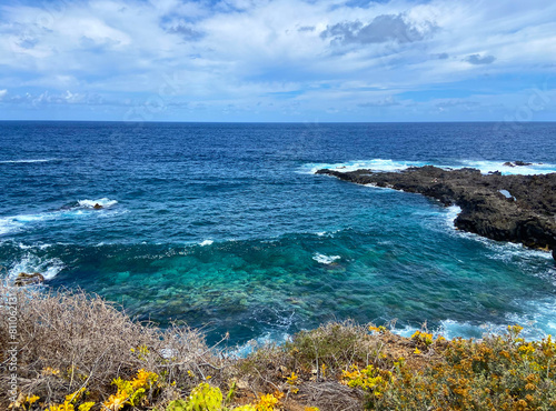 Blue Atlantic ocean water, cliffs and waves near Buenavista del Norte,Tenerife,Canary Islands,Spain.