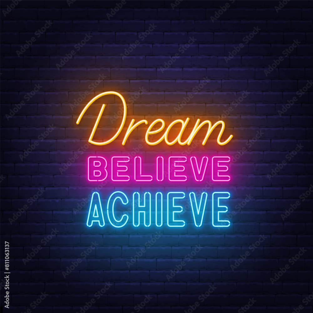 Dream Believe Achieve neon lettering on brick wall background Dream Believe Achieve neon lettering on brick wall background