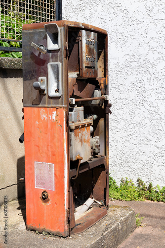 Old-timey gas pump. Old rusty gas pump in a street. Old Gasoline Pump in France photo