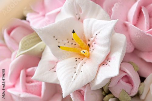 Zephyr bouquet of flowers in a wicker basket on a light background