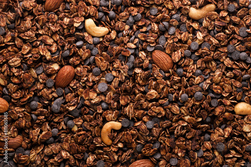 Chocolate granola with nuts background. Top view