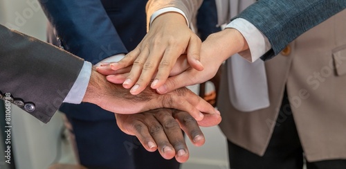 multiethnic business teamwork putting join hands together. Unity and teamwork show by Stack mix of hands with Spirit diversity solidarity team Partner. Joins hands together teamwork meetings empower.