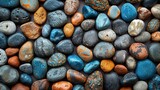   A close-up of various-sized and colored rocks stacked atop one another