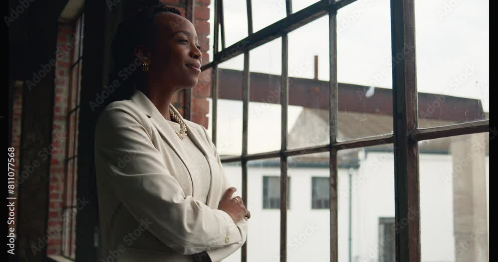 Confident Businesswoman Reflecting in a Modern Industrial Coworking Space Confident Businesswoman Reflecting in a Modern Industrial Coworking Space