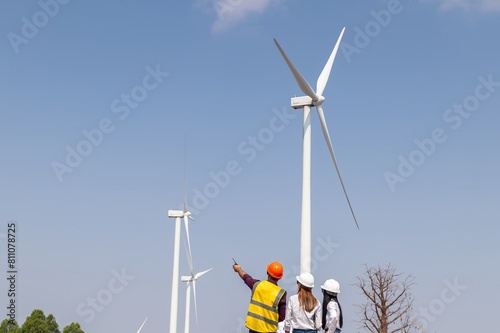 engineer team inspection check control wind power machine construction installation in wind energy factory. technician professional worker discussion check for maintenance electronic wind turbine