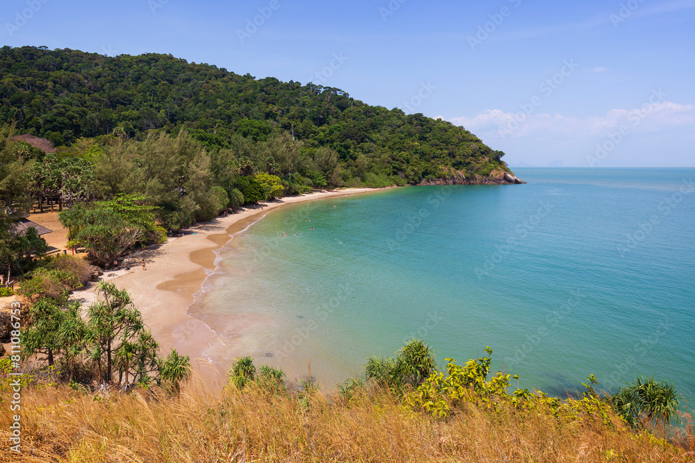 Scenic view of turquoise sea, beach and lush nature from above at the Mu Ko Lanta National Park in Koh Lanta, Thailand, on a sunny day.