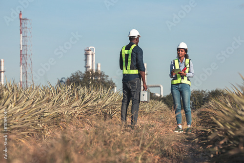 Engineer survey team  checking construction project  inspection work construction site .Team Civil engineer working outdoor next to the power plant. © kanpisut