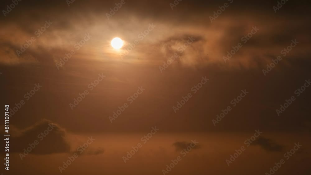 Solar eclipse through the clouds during the sunset Solar eclipse through the clouds during the sunset
