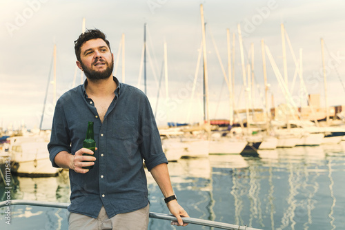 Casual Man Enjoying Beer at Marina