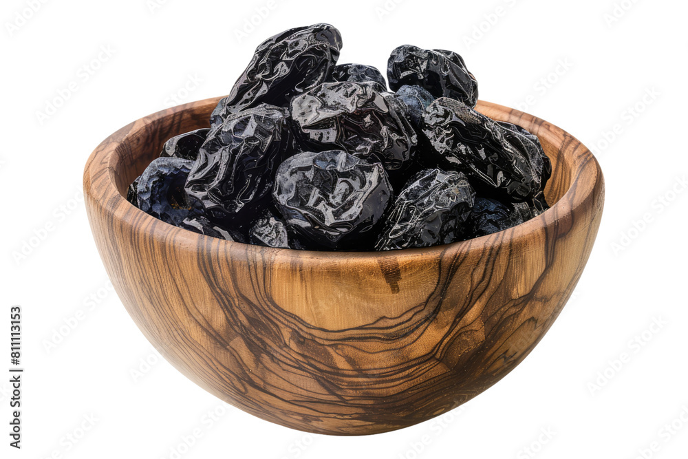 Prunes in a wooden bowl isolated on transparent background Prunes in a wooden bowl isolated on transparent background