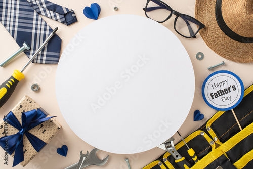 A creative arrangement for Father's Day featuring tools, a hat, glasses, a tie, and a festive Happy Father's Day badge on a neutral beige background