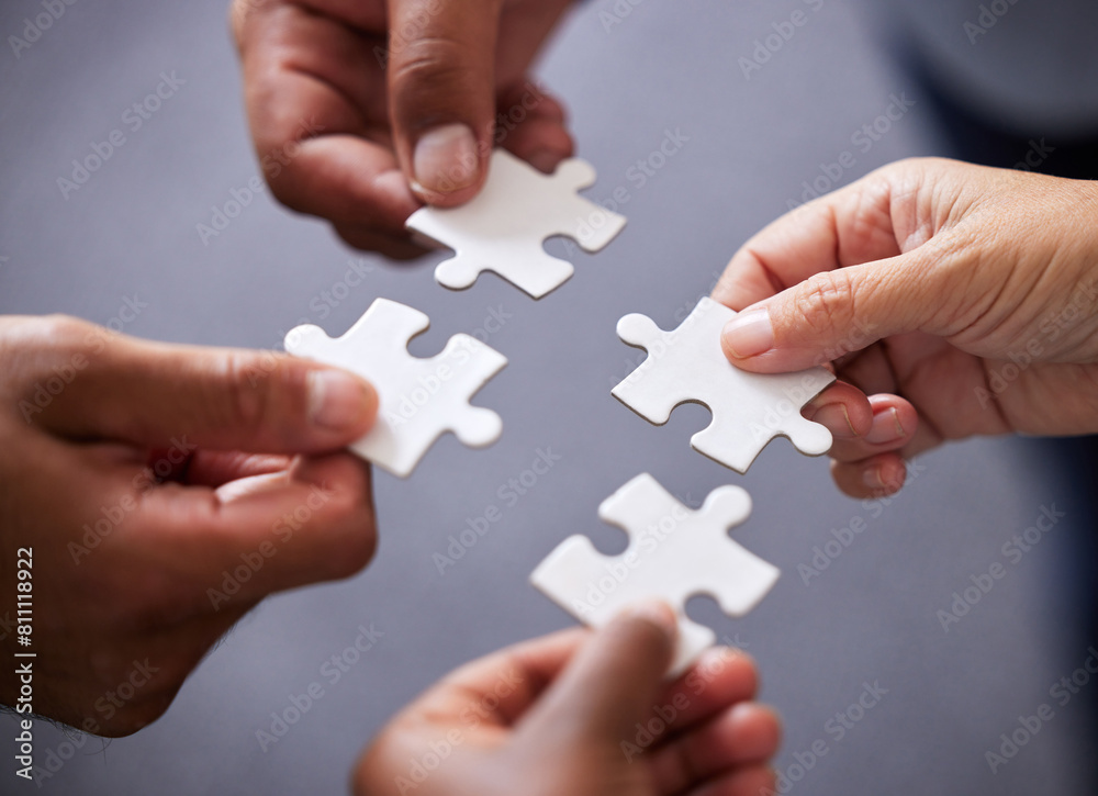 Hands, collaboration and business people with puzzle in office for teamwork or synergy with joint effort. Corporate, group and partnership with unity in company or trust with employees in Sweden. Hands, collaboration and business people with puzzle in office for teamwork or synergy with joint effort. Corporate, group and partnership with unity in company or trust with employees in Sweden.
