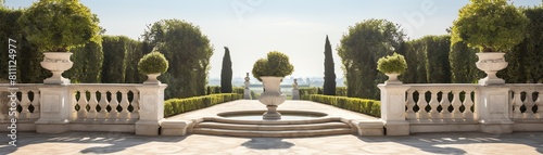 A classical product presentation space with a sculpted marble podium in a formal French garden, lined with manicured hedges and symmetrically placed topiaries photo