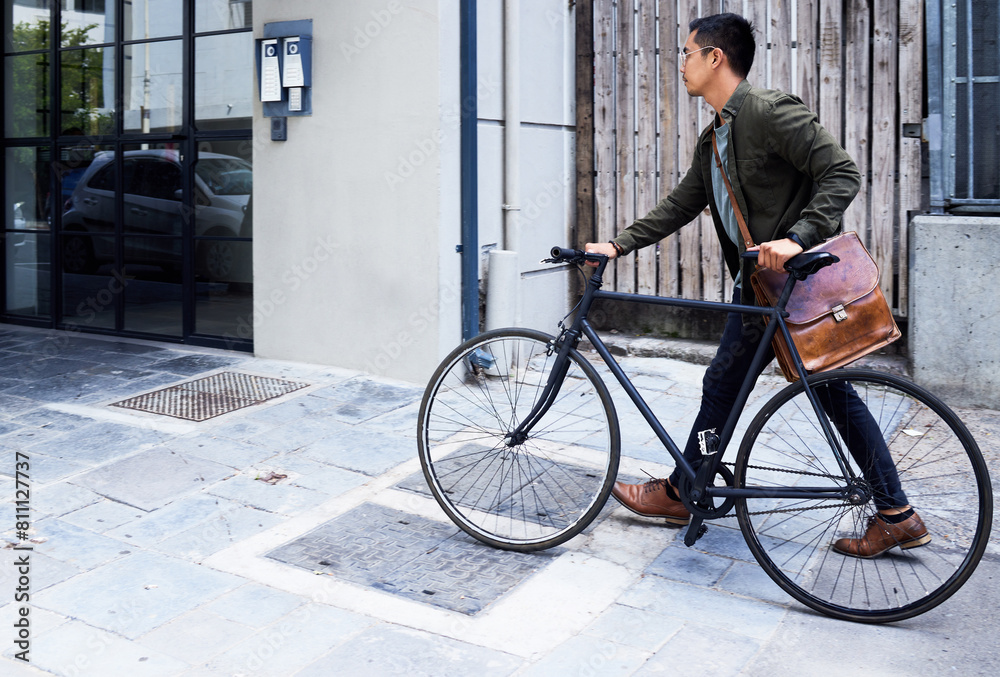 Street, apartment and man with bicycle in city commuting to work for creative career. Transport, travel and male designer with carbon footprint for cycling to office with bike in town in Amsterdam. Street, apartment and man with bicycle in city commuting to work for creative career. Transport, travel and male designer with carbon footprint for cycling to office with bike in town in Amsterdam.