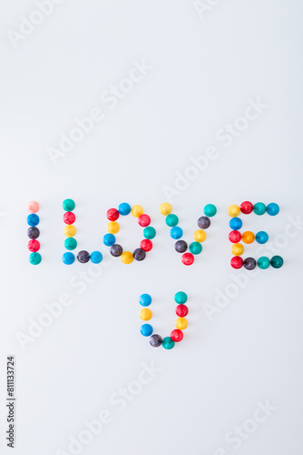 ludo tokens forming the word "I love U" on white background
